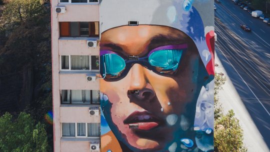 EXCLUSIV | Creatorii muralului cu Popovici: “Urmează Hagi, Patzaichin, doamna Lipă”. David a ales sloganul “Scrie-ți povestea prin sport!”